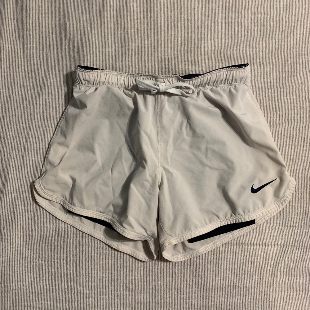 White Nike running shorts